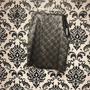 Skin-tight zip-up gold skirt